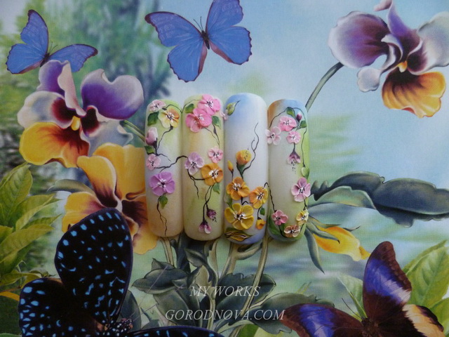 Acrylic design of nails. Florists. Flowers